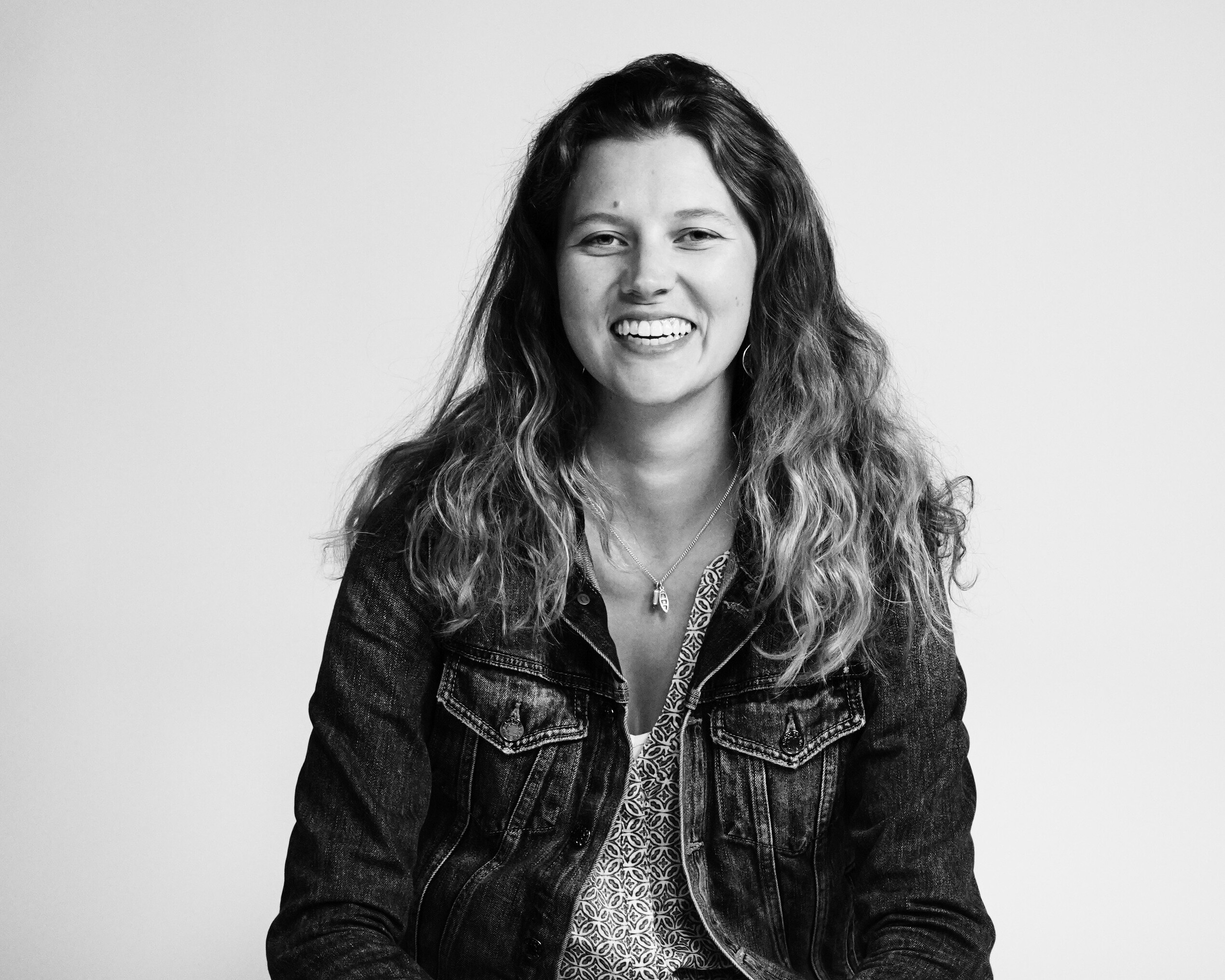 Emily smiles in front of the camera